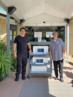 Caloundra Private Clinic Donna Kain (right) and Green Zebra co-owner Adrian Christanou with an order of 44 pasta and gourmet salad meals.